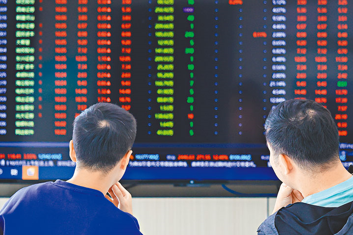扣除非製造業的銀行股及2024年之後上市的新股，A股上市公司2024年淨利潤年減5.4%。圖/取自新華網